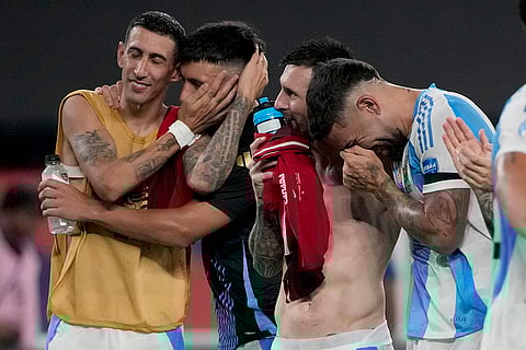 Argentina players celebrate after defeating Canada 2-0